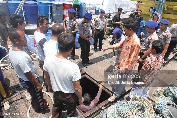 Indonesian Police officers catch illegal Malaysian fishing boats and 11 crews from Thailand, 3 from Myanmar, on March 16, 2016 in Indonesian sea,...