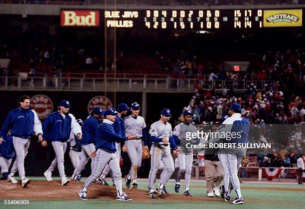 Toronto Blue Jays Manager Cito Gaston walks to greet his team 20 October 1993 after they defeated the Philadelphia Phillies 15-14 in game four of the...