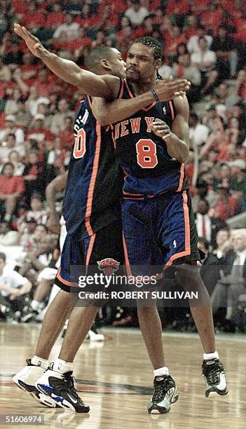 New York Knicks' Latrell Sprewell celebrates after a basket with teammate Allan Houston 08 May 1999 during game one of their first round play-off...