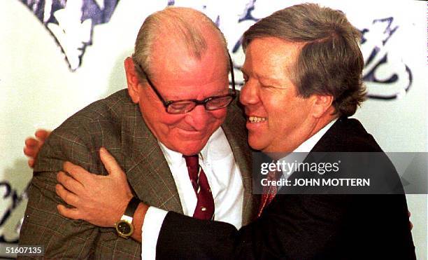 Boston businessman Robert Kraft hugs James Orthwein during a press conference in Boston, MA, concerning his purchase of the New England Patriots...