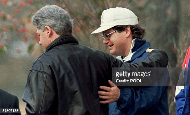 President Bill Clinton comforts his half-brother Roger 07 January 1994 in Hot Springs, AR after paying their respects to their mother Virginia...