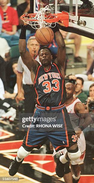 Patrick Ewing of the New York Knicks dunks the ball against the Miami Heat 16 May during game five of their 1st round play-off game at the Miami...