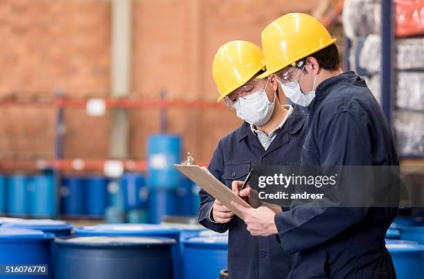 workers working at a chemical plant - chemical imagens e fotografias de stock