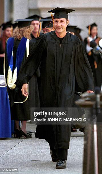 Crown Prince Haakon Magnus of Norway walks across stage to receive his undergraduate diploma in Political Science from the University of California...
