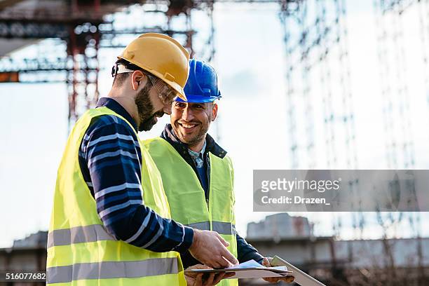 engineer and construction site manager dealing with next construction phase - bridge built structure stock pictures, royalty-free photos & images
