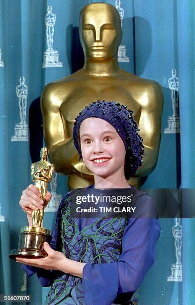 Actress Anna Paquin of New Zealand poses with the 1993 Oscar she received for best supporting actress during the 66th annual Academy Awards 21 March...