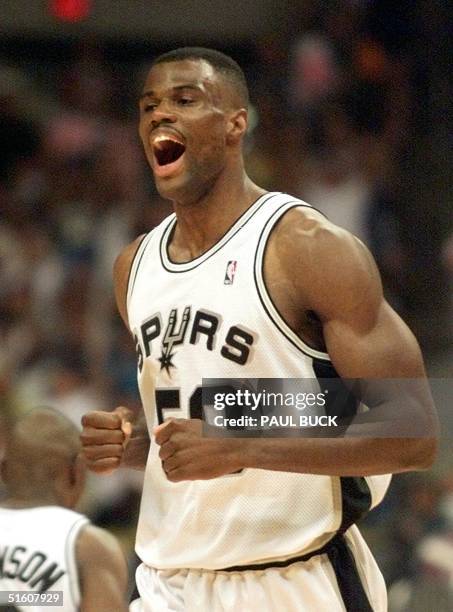David Robinson of the San Antonio Spurs yells after making a basket against the Portland Trail Blazers 29 May 1999 during game one of the NBA Western...