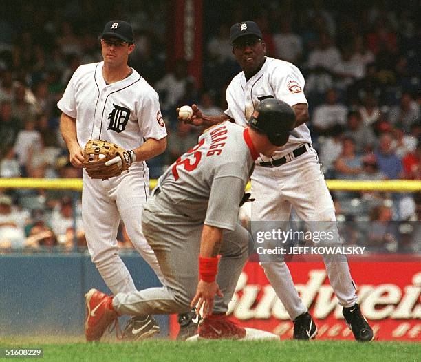 St. Louis Cardinals player Darren Bragg is safe at second in the fifth inning on a fielders choice as Detroit Tigers Deivi Cruz can't tag the base in...