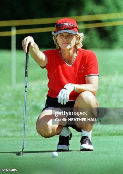 Helen Dobson, of the UK, lines up her putt on the third green 24 June in the first round of play in the LPGA Championship at the DuPont Country Club...