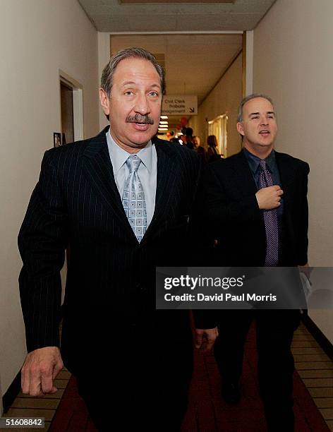 Attorney Mark Geragos and Patrick Harris leave the San Mateo County Courthouse in Redwood City, California on October 28, 2004 for a lunch break...