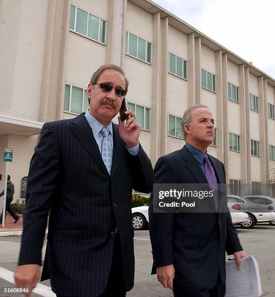 Attorney Mark Geragos and Pat Harris leave the San Mateo County Courthouse in Redwood City, California on October 28, 2004 for a lunch break during...