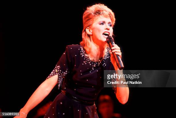 British-born Australian musician and actress Olivia Newton-John performs onstage, Chicago, Illinois, August 29, 1982.