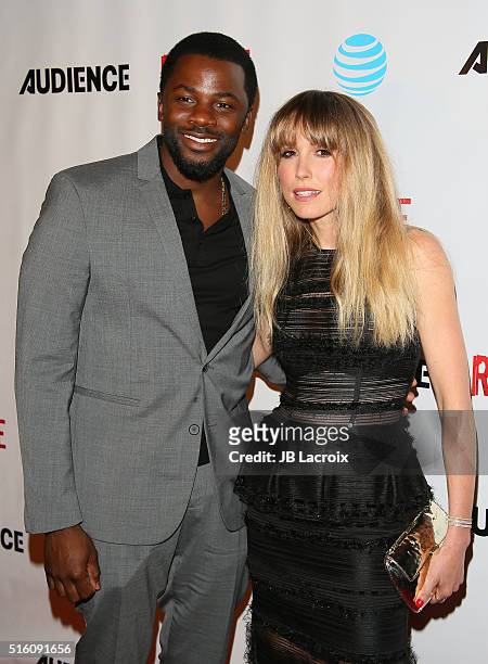 Derek Luke and Sarah Carter attend the premiere of DirecTV's 'Rogue' on March 16, 2016 in West Hollywood, California.