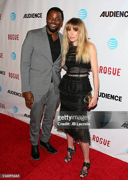 Derek Luke and Sarah Carter attend the premiere of DirecTV's 'Rogue' on March 16, 2016 in West Hollywood, California.