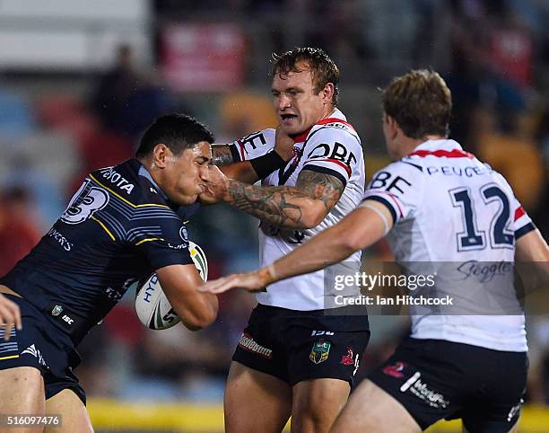 Jason Taumalolo of the Cowboys is tackled by Jake Friend of the Roosters during the round three NRL match between the North Queensland Cowboys and...