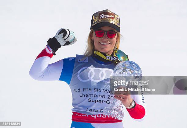Lara Gut of Switzerland poses with the crystal globe for overall Super G during the Audi FIS Alpine Skiing World Cup Super G on March 17, 2016 in St...