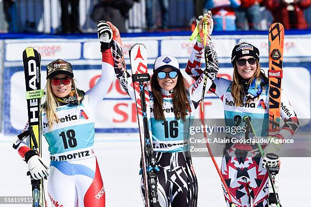 Lara Gut of Switzerland takes 2nd place, Tina Weirather of Liechtenstein takes 1st place and Cornelia Huetter of Austria takes 3rd place during the...