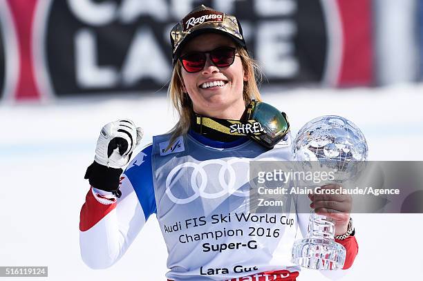 Lara Gut of Switzerland wins the globe in the overall standings during the Audi FIS Alpine Ski World Cup Finals Men's and Women's Super-G on March...