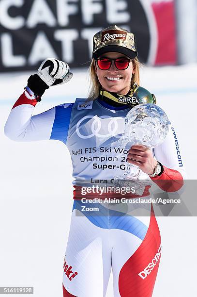 Lara Gut of Switzerland wins the globe in the overall standings during the Audi FIS Alpine Ski World Cup Finals Men's and Women's Super-G on March...