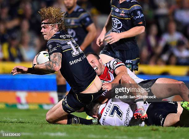 Ian Henderson of the Roosters has his lower leg broken whilst trying to tackle Ethan Lowe of the Cowboys during the round three NRL match between the...