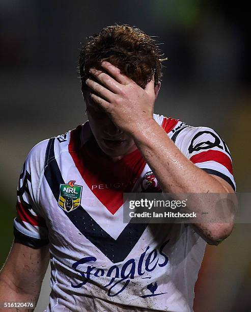 Dylan Napa of the Roosters looks dejected whist walking from the field during the round three NRL match between the North Queensland Cowboys and the...