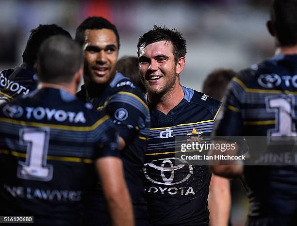 Kyle Feldt of the Cowboys smiles after Jason Taumalolo scored a try during the round three NRL match between the North Queensland Cowboys and the...