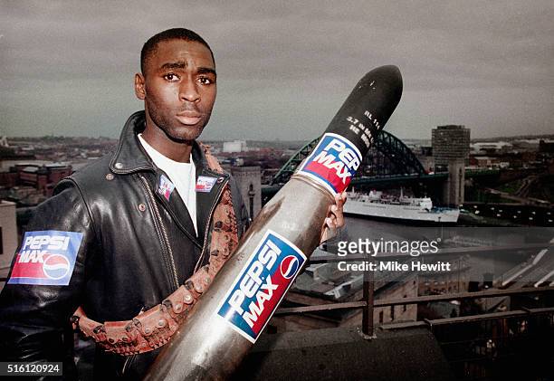 Newcastle United striker Andy Cole pictured holding a missile during a sponsors shoot overlooking the city of Newcastle on January 26, 1994 in...