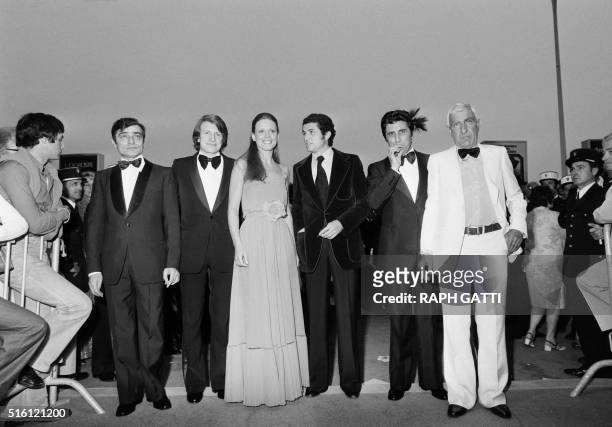 French director Claude Lelouch surrounded by French actors Charles Denner, Andre Dussollier, Swiss actress Marthe Keller, French actors Gilbert...