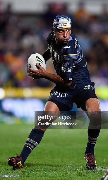 Johnathan Thurston of the Cowboys looks to pass the ball during the round three NRL match between the North Queensland Cowboys and the Sydney...