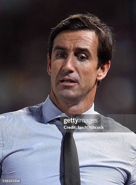 Television commentator Andrew Johns looks on during the round three NRL match between the North Queensland Cowboys and the Sydney Roosters at...