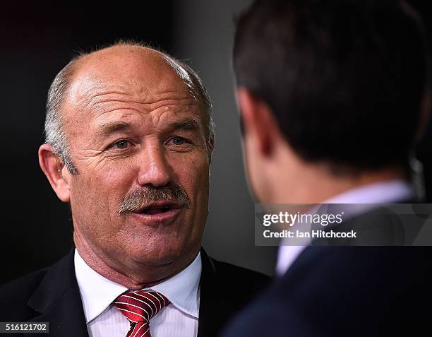 Television commentator Wally Lewis speaks to Brad Fittler before the round three NRL match between the North Queensland Cowboys and the Sydney...