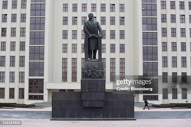 Pedestrian walks past a giant statue of former Communist Party founder Vladimir Lenin on Independence square in Minsk, Belarus, on Wednesday, March...