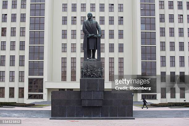 Pedestrian walks past a giant statue of former Communist Party founder Vladimir Lenin on Independence square in Minsk, Belarus, on Wednesday, March...