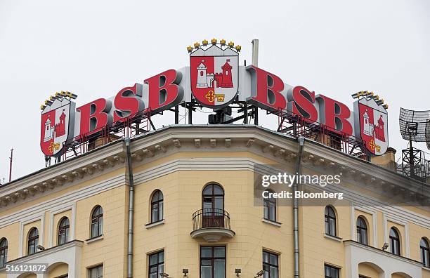 The logo of JSC BSB Bank sits on display above a building in Minsk, Belarus, on Wednesday, March 16, 2016. European Union governments scrapped...