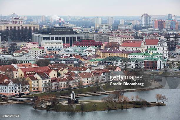 Residential buildings sit beside the Svislach River in the old town, also known as Trinity suburb, in Minsk, Belarus, on Wednesday, March 16, 2016....