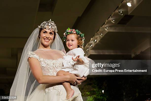 Priscila de Gustin and her daughter Teresa Cutillas walk the runway during I Boda Book fashion show on March 16, 2016 in Madrid, Spain.