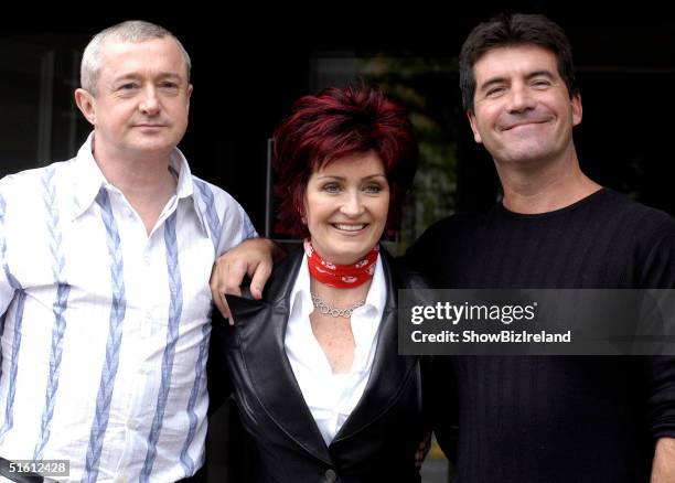 Louis Walsh, Sharon Osbourne and Simon Cowell pose for photos after auditioning hundreds of hopeful musicians for their new TV show "X Factor" at...