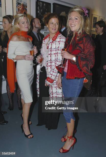 Molly Belle and Cosmo Jenks attend the private view for "Carrera 1964 -2004: 40 Years Of Legend" at the Getty Images Gallery on October 28, 2004 in...