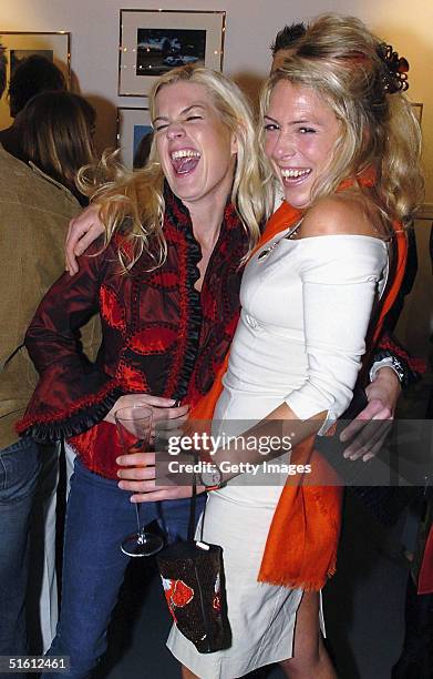 Molly Belle and Cosmo Jenks attend the private view for "Carrera 1964 -2004: 40 Years Of Legend" at the Getty Images Gallery on October 28, 2004 in...