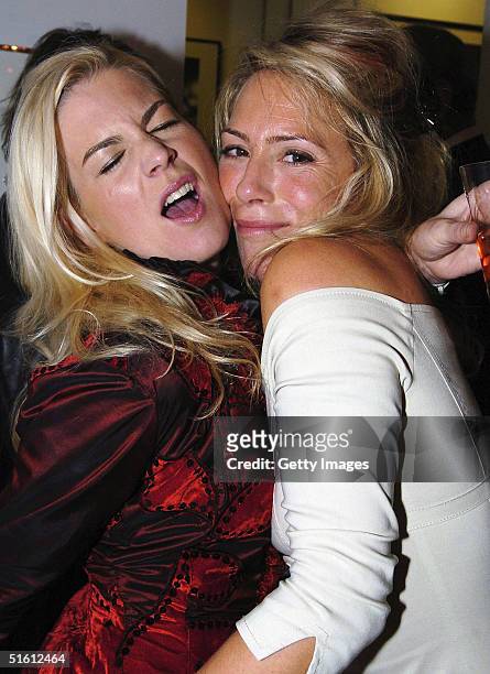 Molly Belle and Cosmo Jenks attend the private view for "Carrera 1964 -2004: 40 Years Of Legend" at the Getty Images Gallery on October 28, 2004 in...