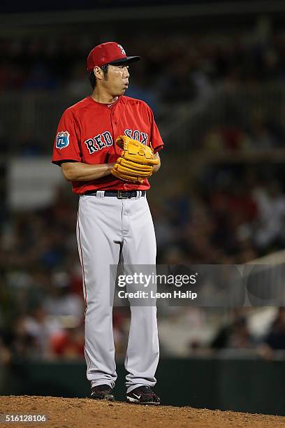 Koji Uehara of the Boston Red Sox pitches during the fifth inning of the Spring Training Game against the Minnesota Twins on March 16, 2016 at...