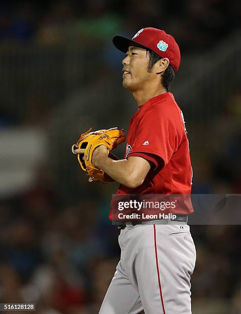 Koji Uehara of the Boston Red Sox reacts after giving up a solo home run to Eddie Rosario of the Minnesota Twins during the fifth inning of the...