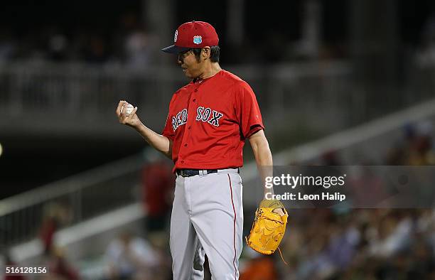 Koji Uehara of the Boston Red Sox reacts after giving up a solo home run to Eddie Rosario of the Minnesota Twins during the fifth inning of the...