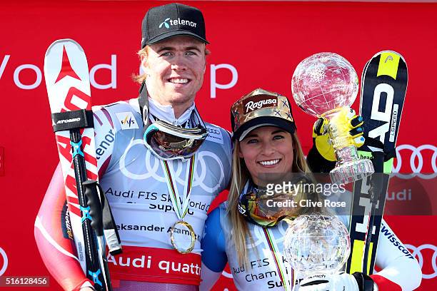 Lara Gut of Switzerland and Aleksander Aamodt Kilde of Norway win the SuperG crystal globes during the Audi FIS Alpine Ski World Cup Finals Men's and...