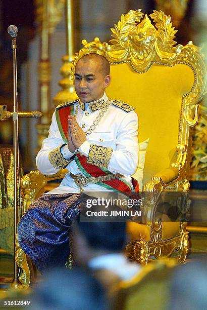 Cambodia's King Norodom Sihamoni sits on his throne during his coronation ceremony at the Royal Palace in Phnom Penh 29 October 2004. Cambodia's King...