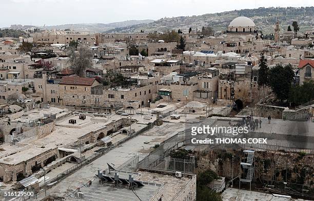Picture shows a general view of roof tops of houses situated in the Jewish Quarter of Jerusalem's Old City, on March 17, 2016. / AFP / THOMAS COEX