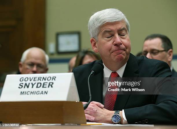Gov. Rick Snyder, , listens to members comments during a House Oversight and Government Reform Committee hearing, about the Flint, Michigan water...