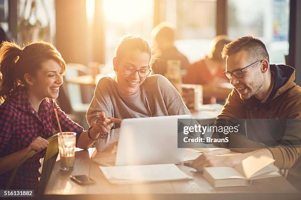 university students using computer for their research in a cafe. - group of university students stockfoto's en -beelden