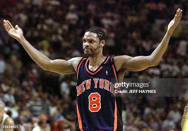 Latrell Sprewell of the New York Knicks reacts as the Indiana Pacers crowd starts chanting his name 09 June during the second half of game five of...