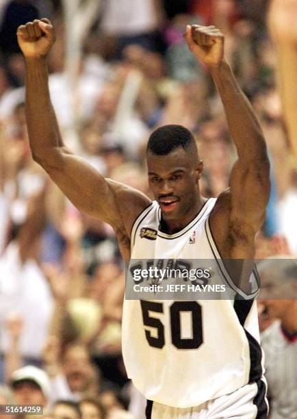 David Robinson of the San Antonio Spurs celebrates a basket in the fourth quarter against the New York Knicks during game one of the NBA Finals16...